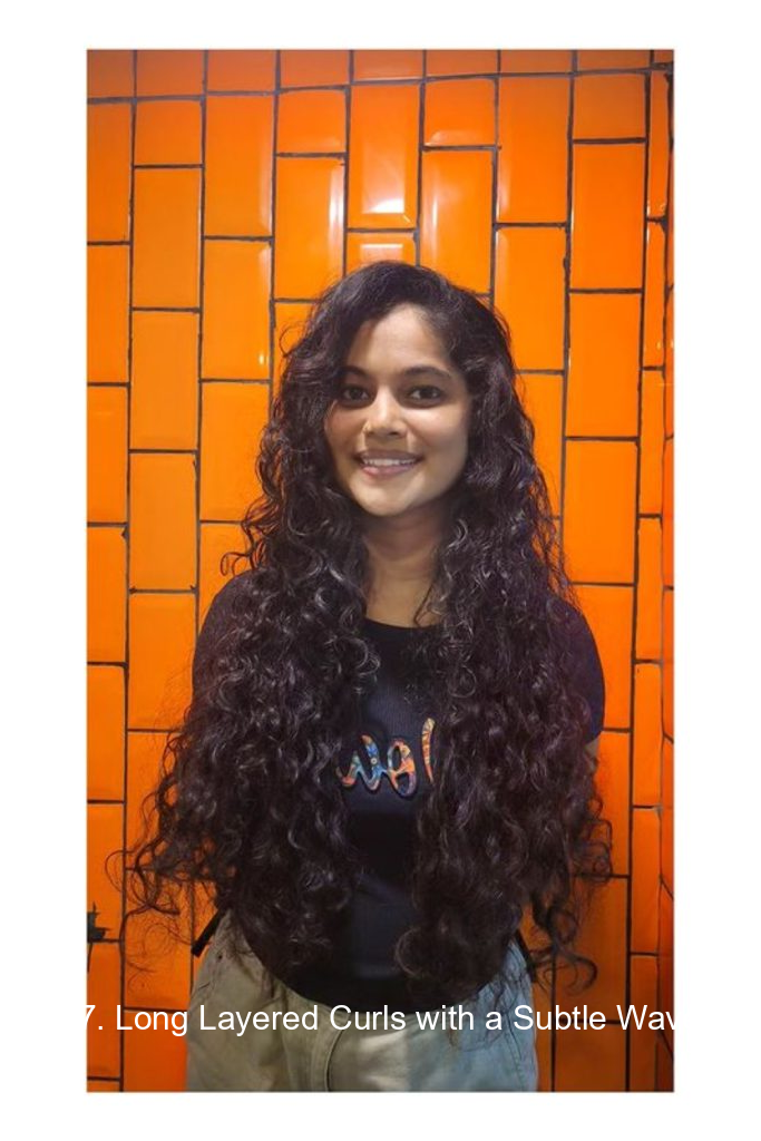 17. Long Layered Curls with a Subtle Wave
