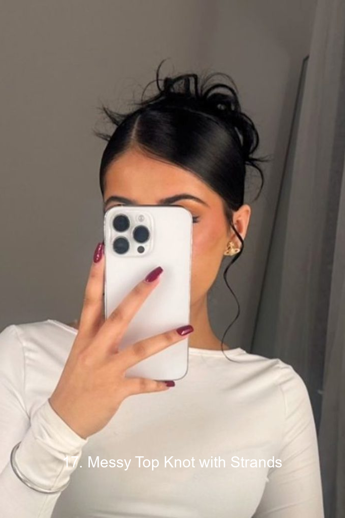 17. Messy Top Knot with Strands