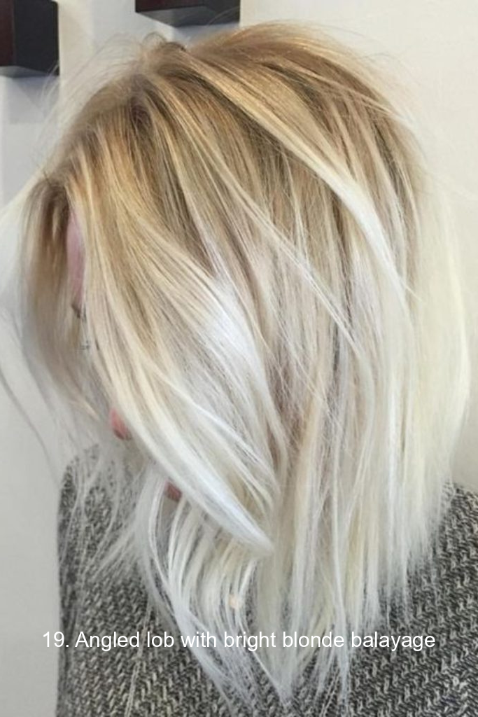 19. Angled lob with bright blonde balayage